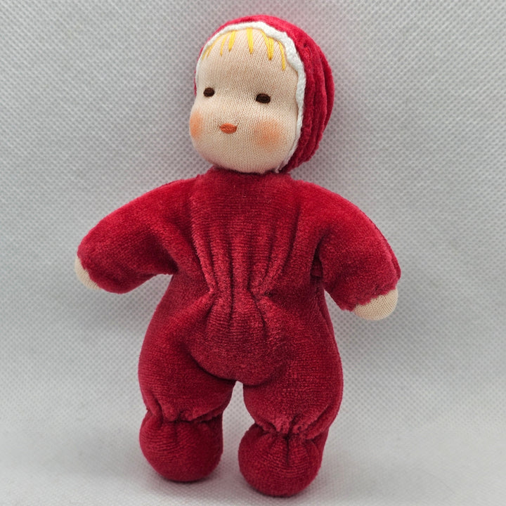 Red plush toy on a light gray background