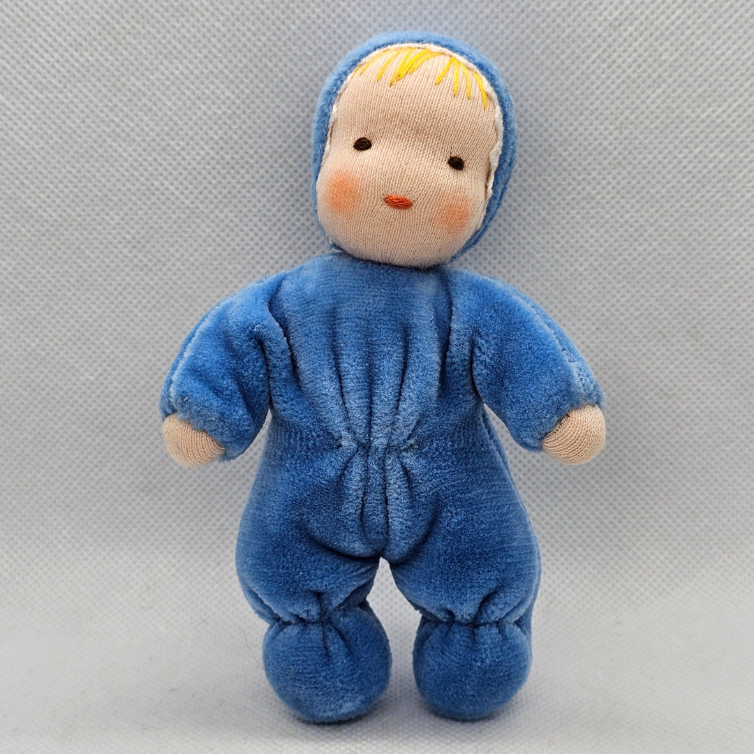 Small blue plush toy on a gray background