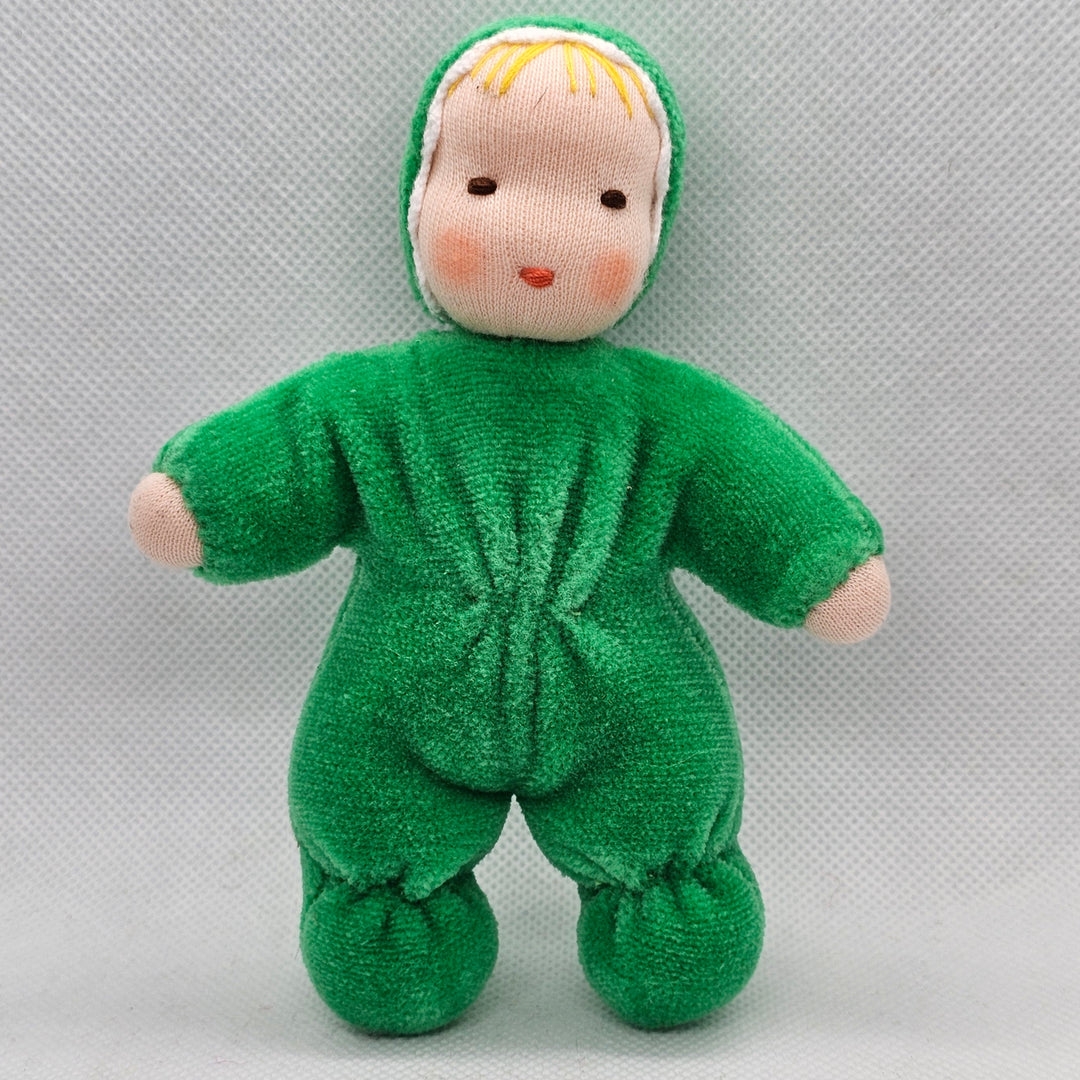 Green plush baby toy on a light gray background
