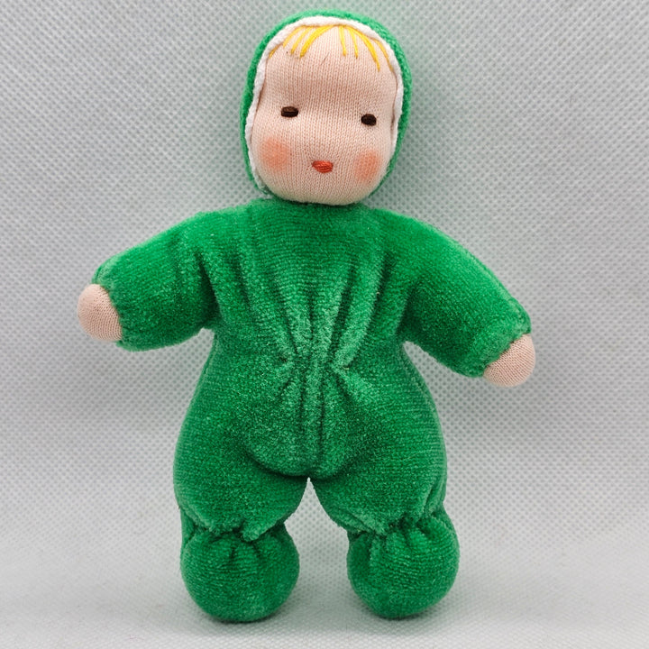 Green plush baby toy on a light gray background